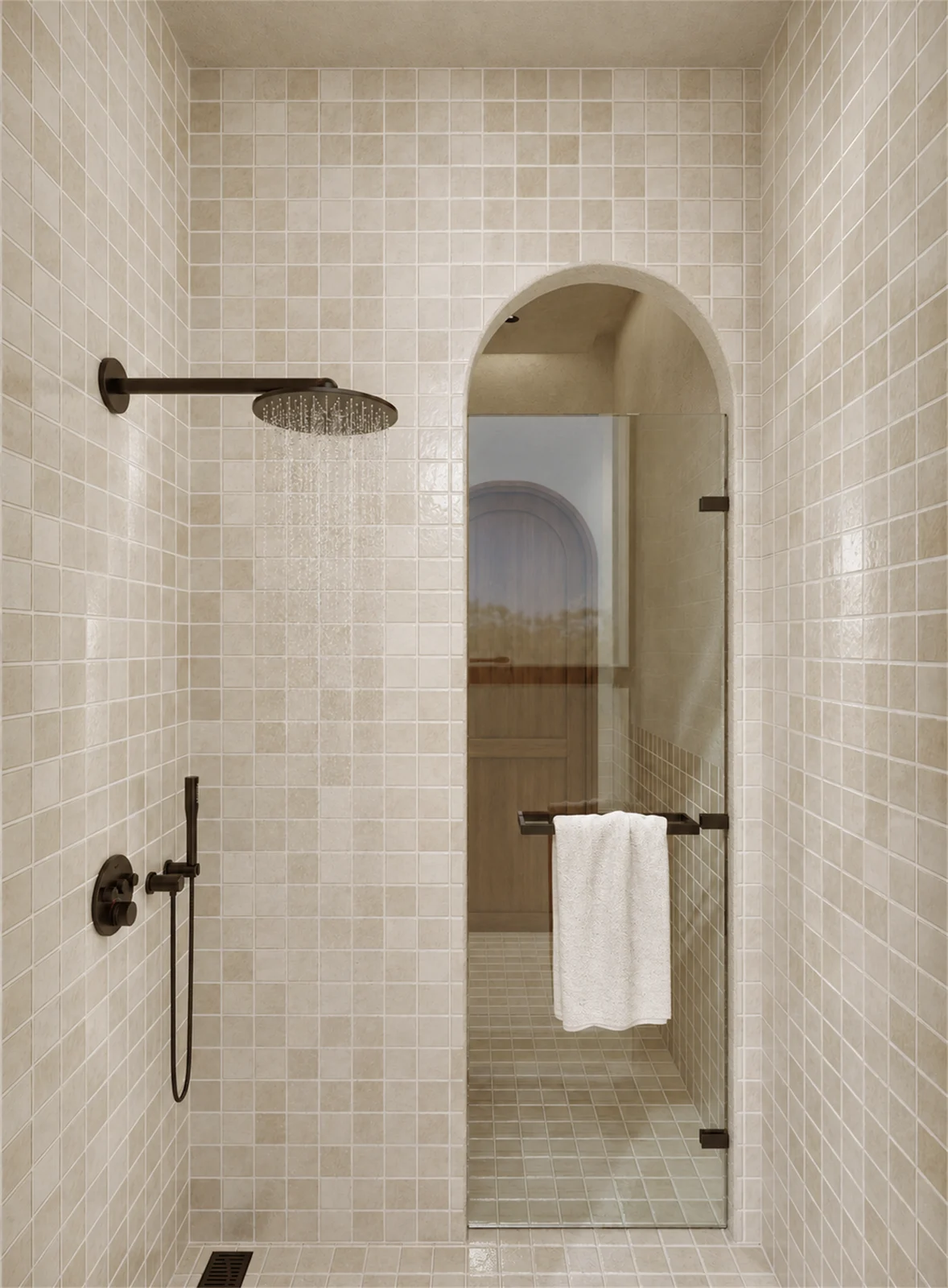 Tiled shower & arched opening