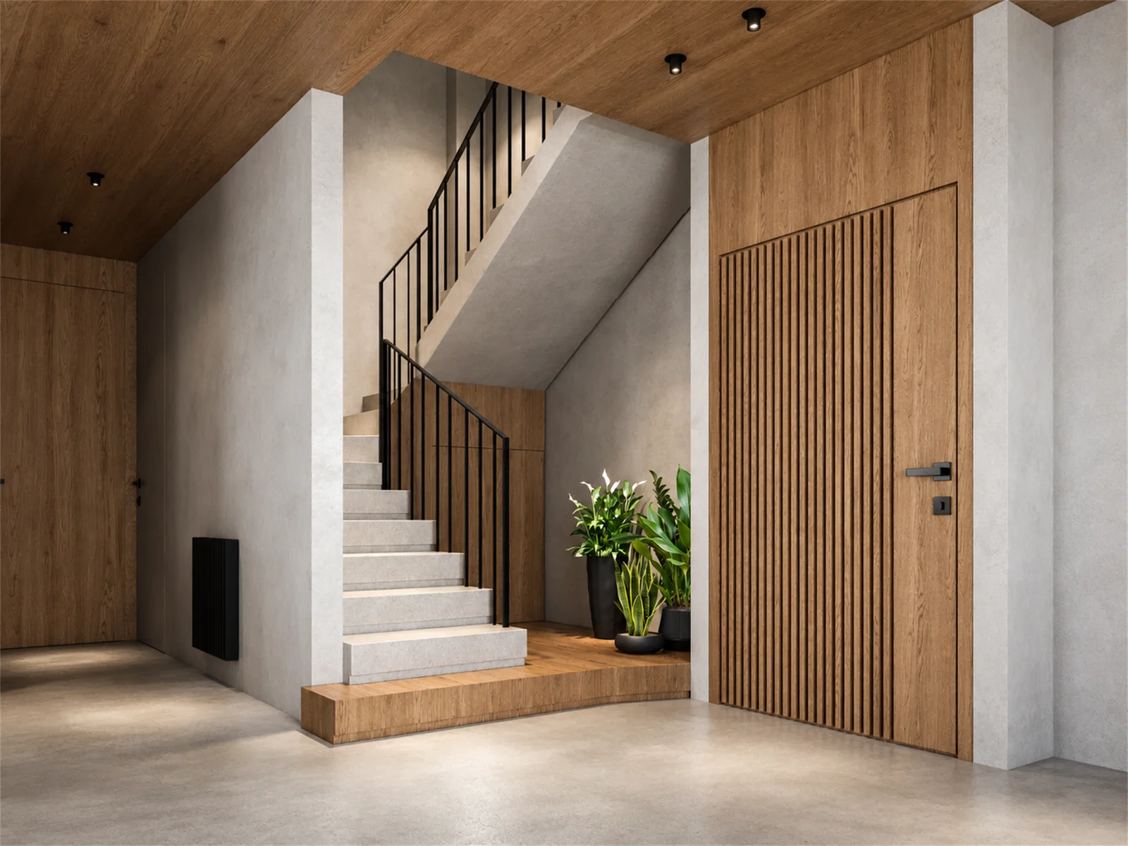 Pale staircase with black balustrades and a timber-lined entrance