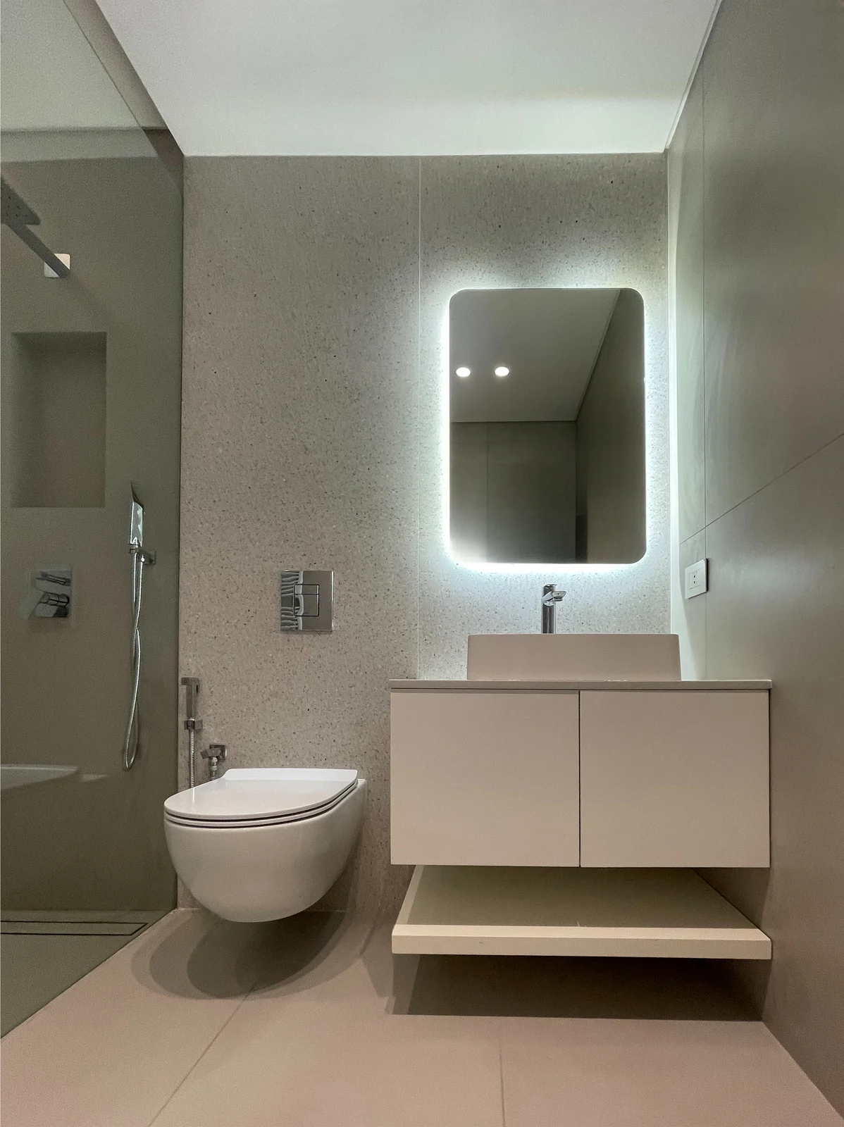 Bathroom with illuminated mirror