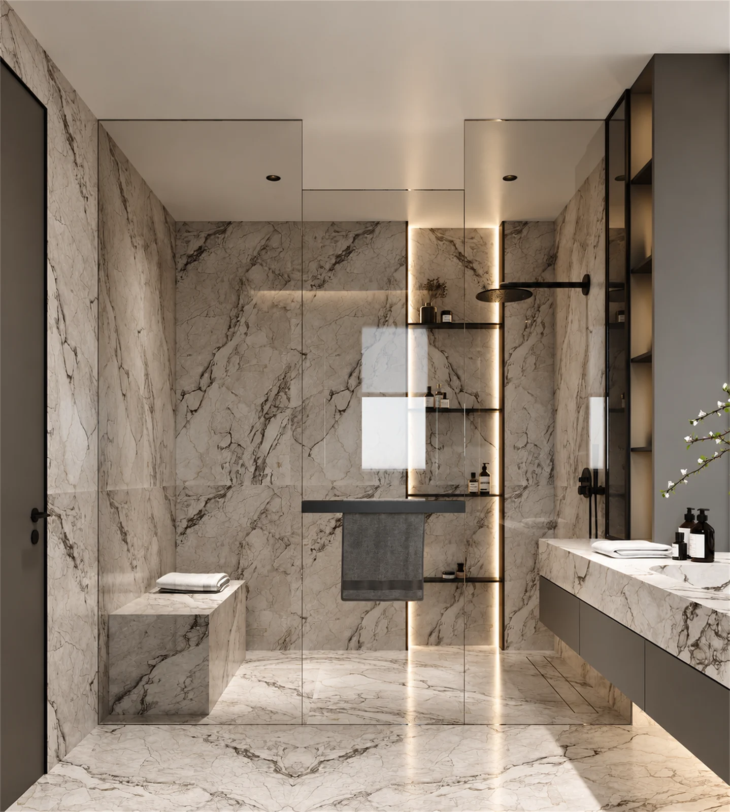 Main bathroom shower with veined surfaces & recessed shelving