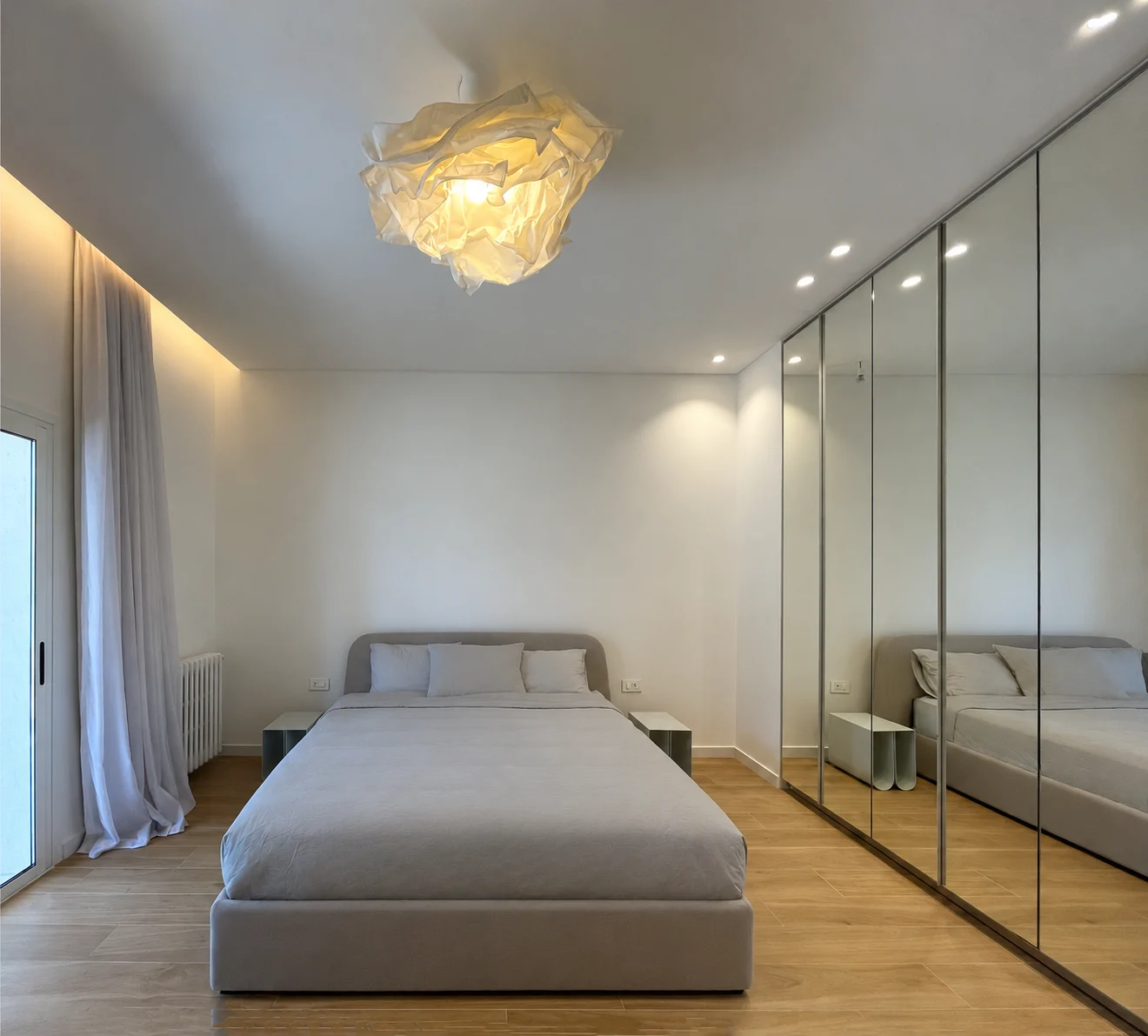 Bedroom with sculptural pendant light