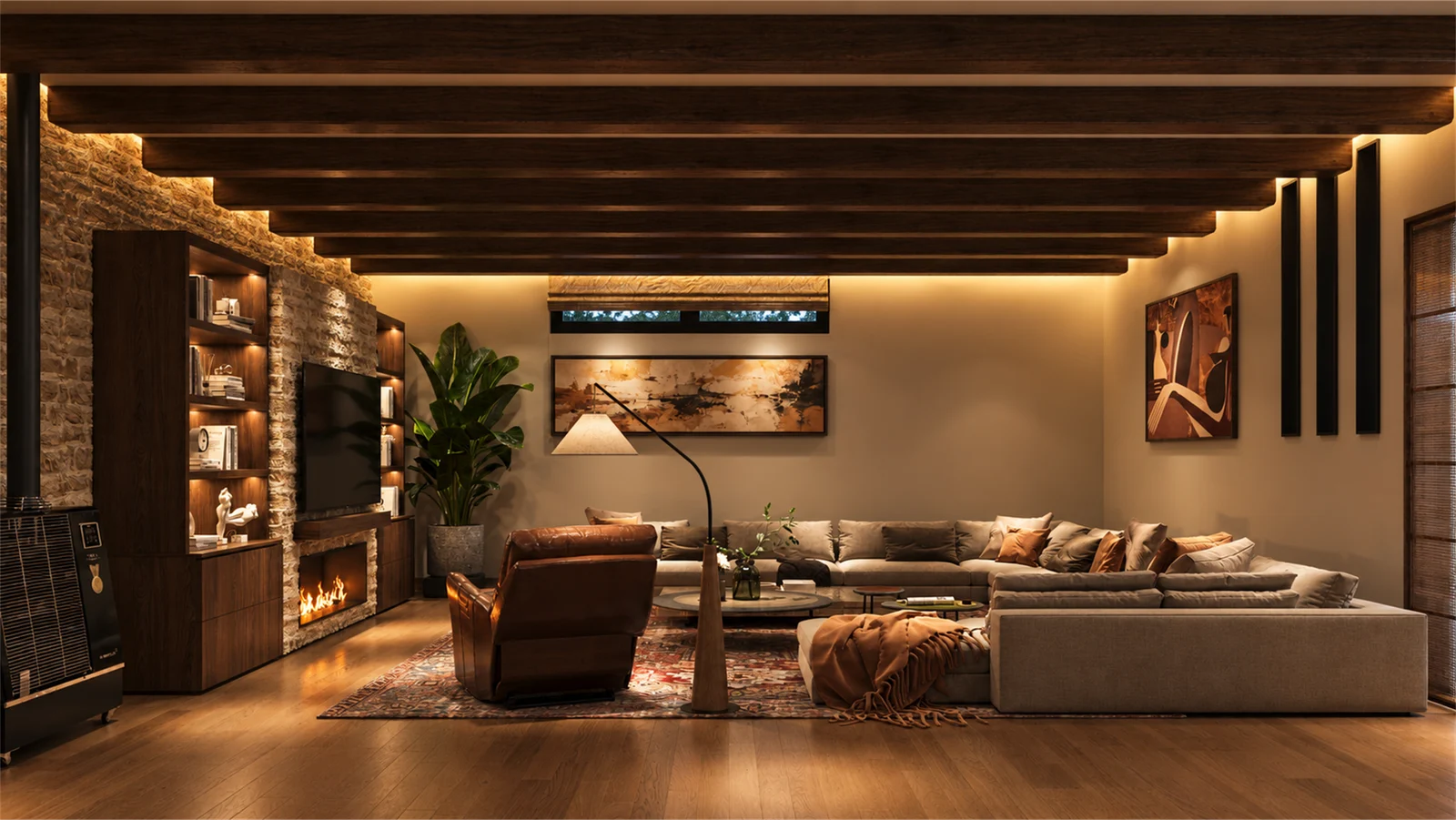 Basement sitting area with generous sofas and a warm stone fireplace wall