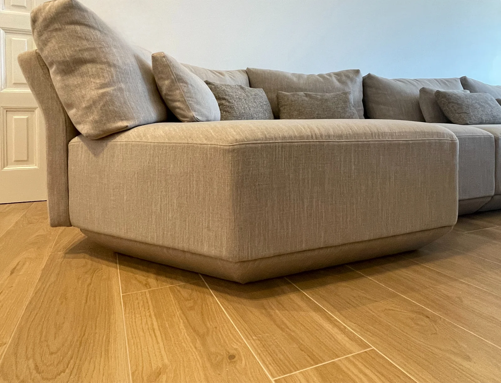 Sofa upholstery & warm wood flooring