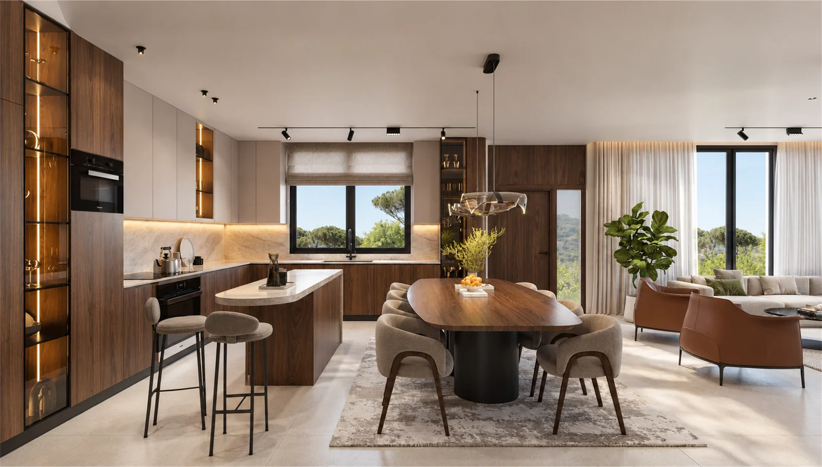 Open kitchen with an island breakfast counter beside the dining and living areas